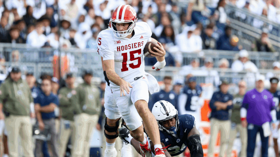 Fernando Mendoza #15 of the Indiana Hoosiers runs the ball against the Penn State Nittany Lions at Beaver Stadium on November 8, 2025 in State College, Pennsylvania.
