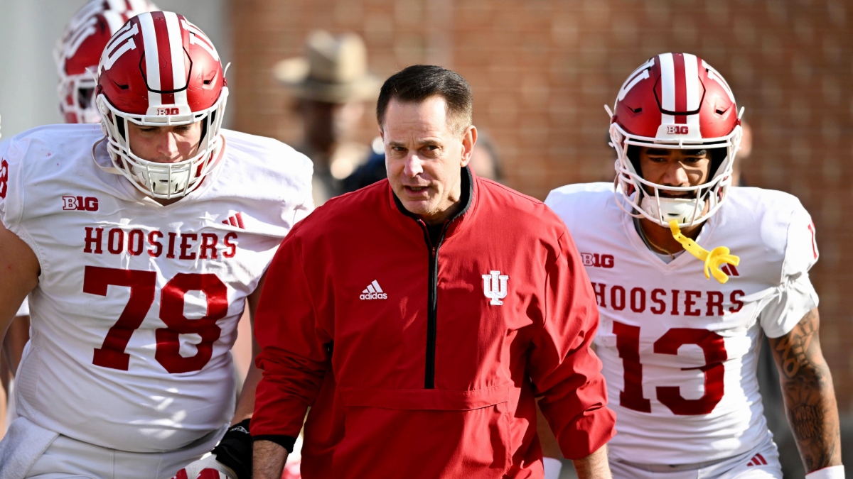 Curt Cignetti of the Indiana Hoosiers leads his team onto the field before the game against the Maryland Terrapins at SECU Stadium on November 01, 2025 in College Park, Maryland.