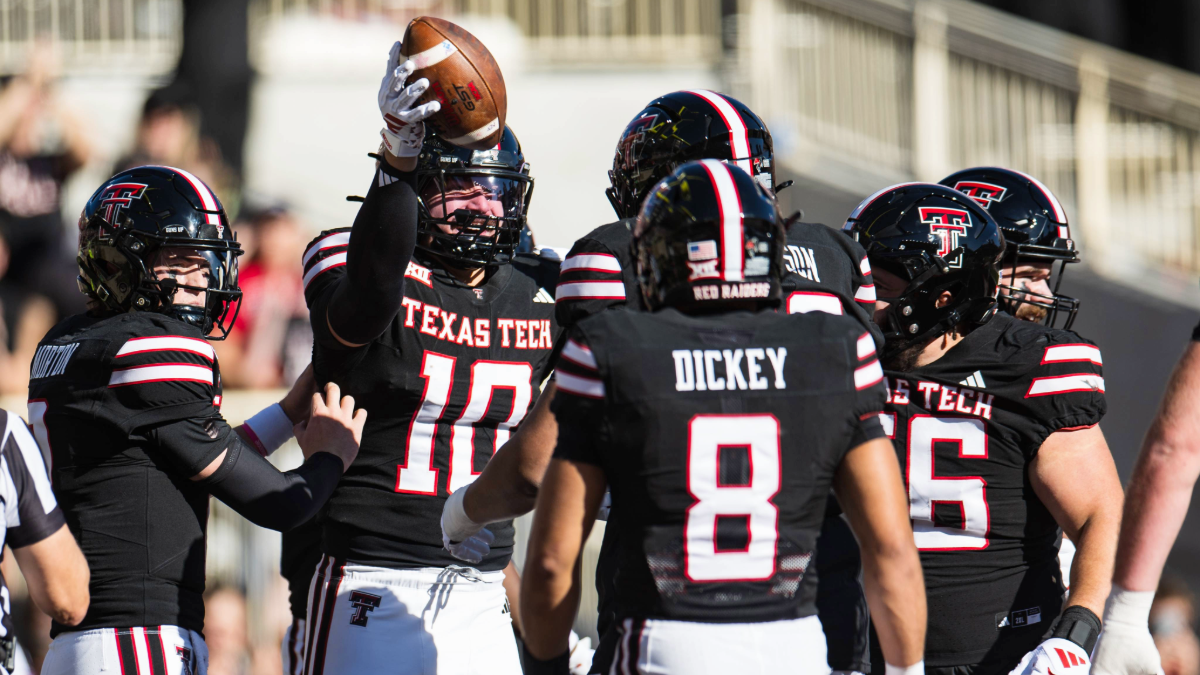 Jacob Rodriguez #10 of the Texas Tech Red Raiders celebrates with teammates after scoring a touchdown during the first half of the game against the UCF Knights at Jones AT&T Stadium on November 15, 2025 in Lubbock, Texas.