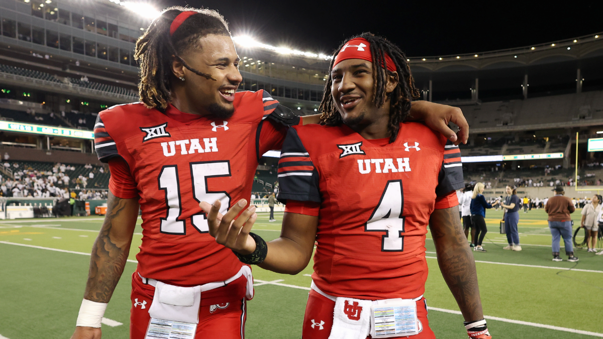 Byrd Ficklin #15 and Devon Dampier #4 of the Utah Utes walk off the field after defeating the Baylor Bears at McLane Stadium on November 15, 2025 in Waco, Texas.