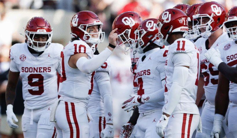 John Mateer #10 of the Oklahoma Sooners talks to players in the huddle during the first quarter of a football game against the Alabama Crimson Tide at Bryant Denny Stadium on November 15, 2025 in Tuscaloosa, Alabama.