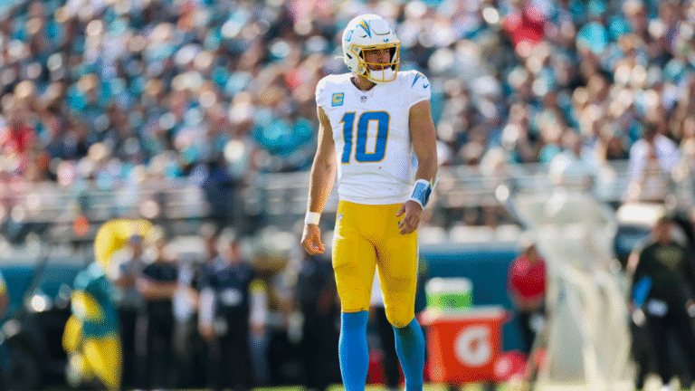 Justin Herbert #10 of the Los Angeles Chargers looks on during an NFL football game against the Jacksonville Jaguars at Everbank Stadium on November 16, 2025 in Jacksonville, Florida.