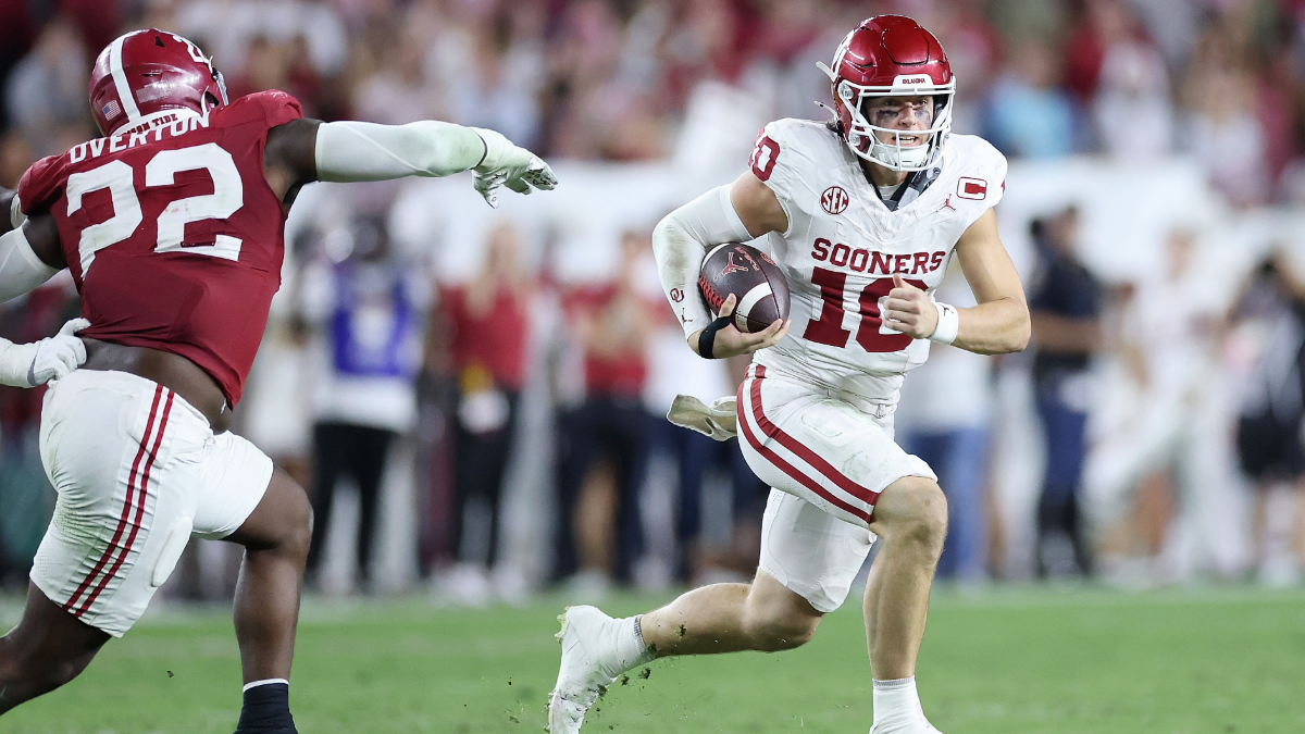 John Mateer #10 of the Oklahoma Sooners rushes against the Alabama Crimson Tide during the third quarter at Bryant-Denny Stadium on November 15, 2025 in Tuscaloosa, Alabama.