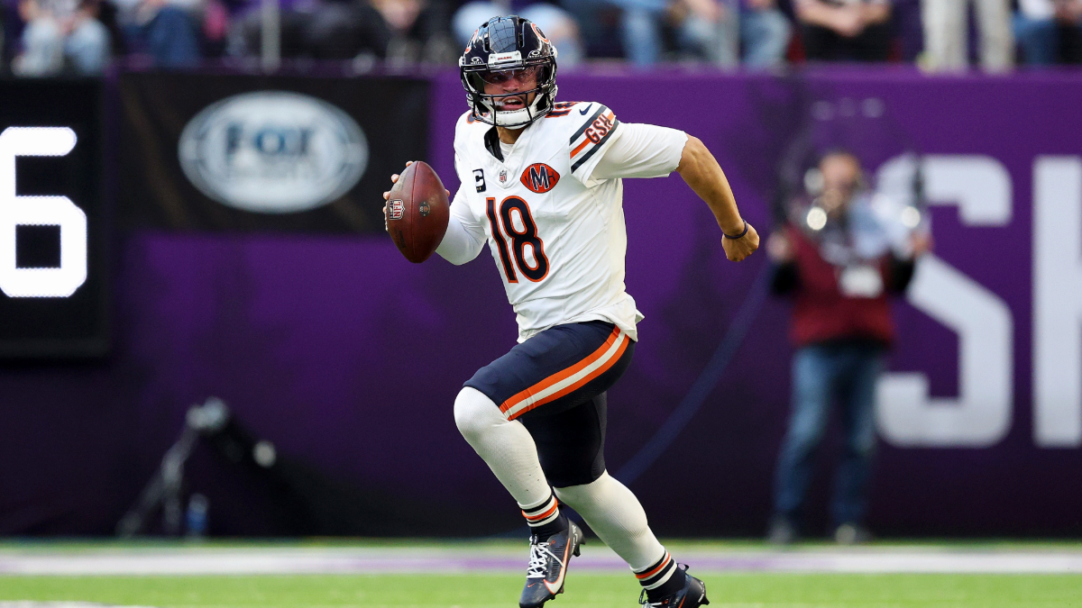 Caleb Williams #18 of the Chicago Bears runs with the ball against the Minnesota Vikings in the third quarter at U.S. Bank Stadium on November 16, 2025 in Minneapolis, Minnesota.