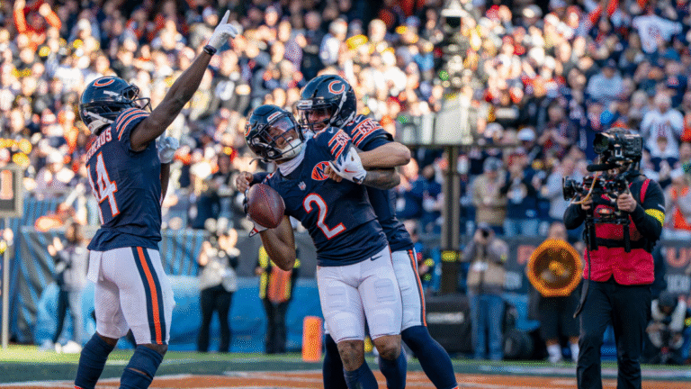 DJ Moore #2 of the Chicago Bears celebrates with Caleb Williams #18 of the Chicago Bears and Olamide Zaccheaus #14 of the Chicago Bears after scoring a touchdown during an NFL football game between the Chicago Bears and the Pittsburgh Steelers at Soldier Field on November 23 2025 in Chicago, Illinois.