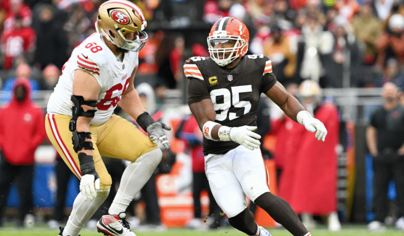 Colton McKivitz #68 of the San Francisco 49ers tries to stop Myles Garrett #95 of the Cleveland Browns during the third quarter at Huntington Bank Field on November 30, 2025, in Cleveland, Ohio. The 49ers defeated the Browns 26-8.