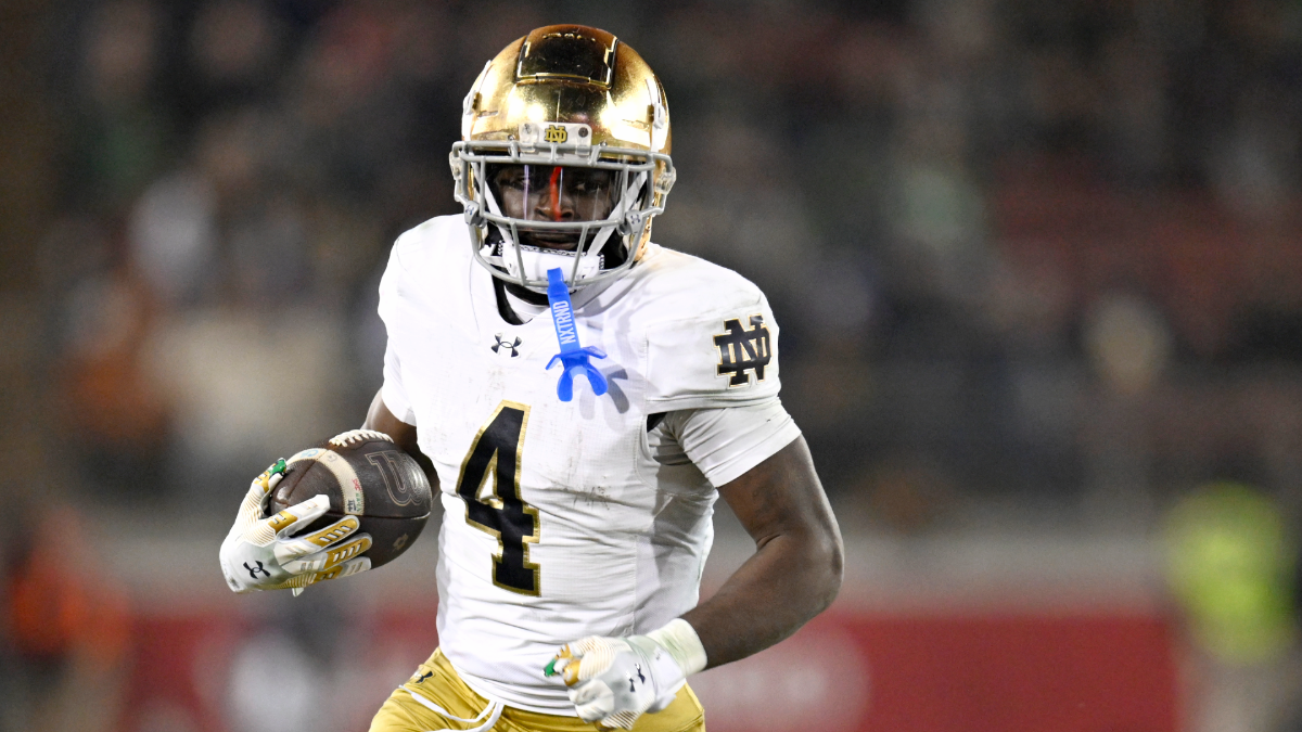 Jeremiyah Love #4 of the Notre Dame Fighting Irish runs the ball against the Stanford Cardinal in the third quarter at Stanford Stadium on November 29, 2025 in Stanford, California.