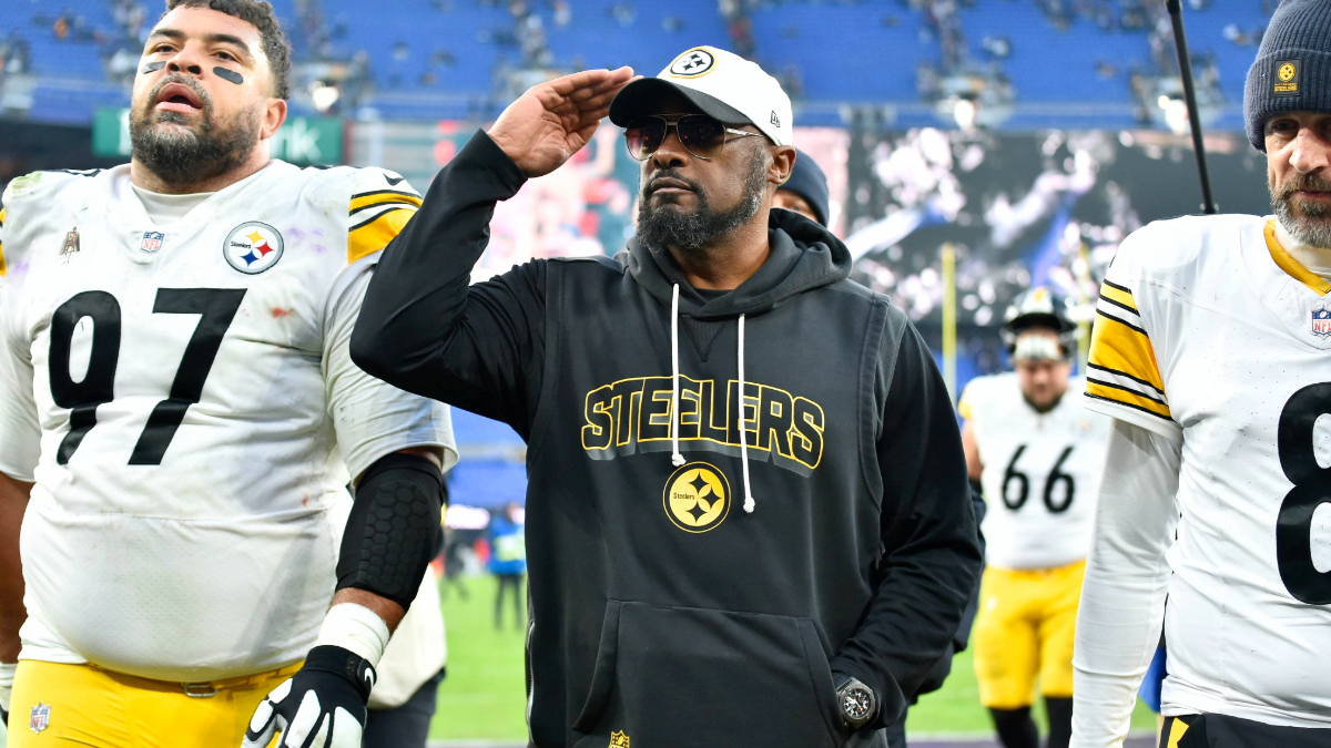 Steelers head coach Mike Tomlin salutes to Steelers fans in the stands while walking off the field with defensive tackle Cameron Heyward (97) and quarterback Aaron Rodgers (8) during the Pittsburgh Steelers versus Baltimore Ravens NFL game at M&T Bank Stadium on December 7, 2025 in Baltimore, MD.