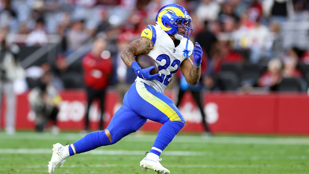 Running back Blake Corum #22 of the Los Angeles Rams runs the ball during the second half against the Arizona Cardinals at State Farm Stadium on December 07, 2025 in Glendale, Arizona. The Rams defeated the Cardinals 45-17.
