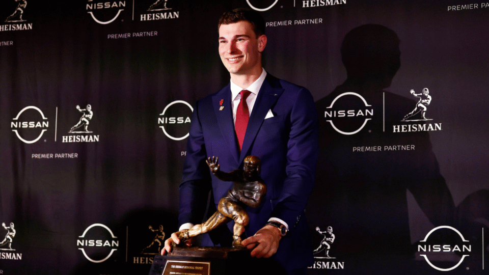 Heisman Trophy candidate quarterback Fernando Mendoza of the Indiana Hoosiers poses with the Heisman Memorial Trophy before the 2025 Heisman Trophy Presentation at Marriott Marquis Hotel on December 13, 2025 in New York City.