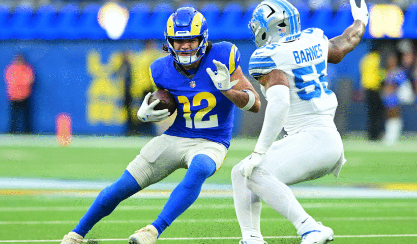 Puka Nacua #12 of the Los Angeles Rams runs after a catch against Derrick Barnes #55 of the Detroit Lions during the third quarter at SoFi Stadium on December 14, 2025 in Inglewood, California.