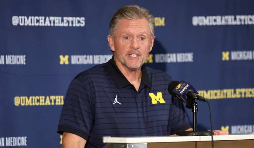 Kyle Whittingham speaks at a news conference introducing him as the new Michigan Wolverines head football coach at the Hyatt Regency Orlando on December 28, 2025 in Orlando, Florida.