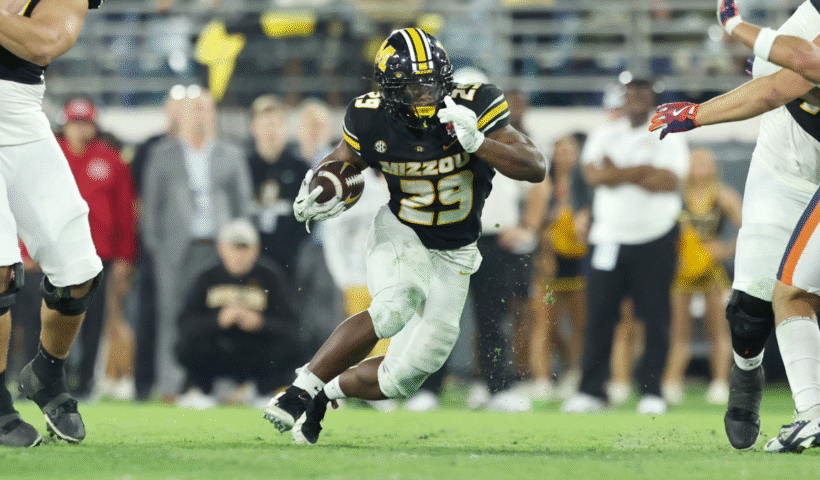 Ahmad Hardy #29 of the Missouri Tigers runs the ball in the 4th quarter of the 2025 TaxSlayer Gator Bowl between the Missouri Tigers and Virginia Cavaliers at EverBank Stadium on December 27, 2025 in Jacksonville, Florida.