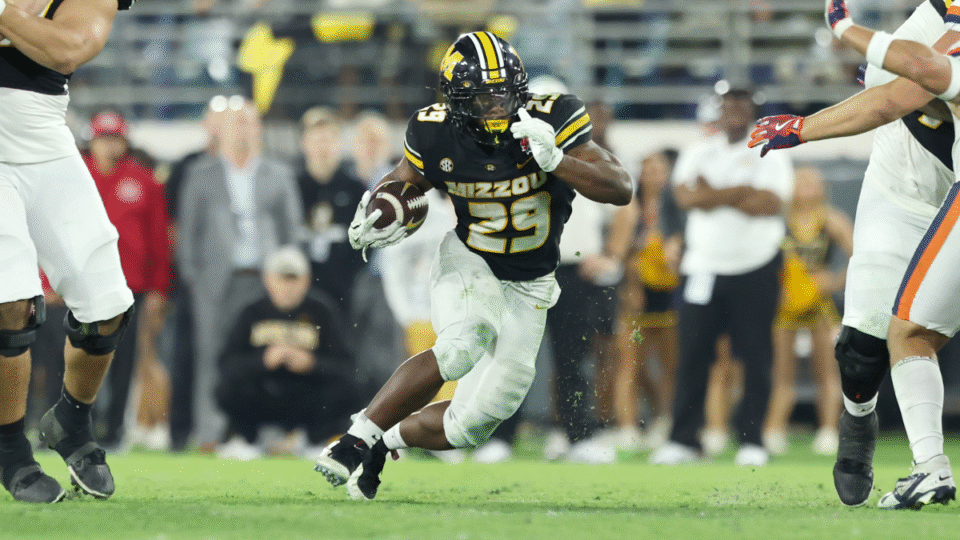 Ahmad Hardy #29 of the Missouri Tigers runs the ball in the 4th quarter of the 2025 TaxSlayer Gator Bowl between the Missouri Tigers and Virginia Cavaliers at EverBank Stadium on December 27, 2025 in Jacksonville, Florida.