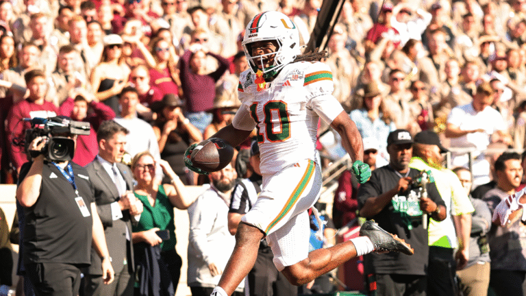 Malachi Toney #10 of the Miami Hurricanes scores a touchdown in the fourth quarter against the Texas A&M Aggies during the 2025 College Football Playoff First Round Game at Kyle Field on December 20, 2025 in College Station, Texas.