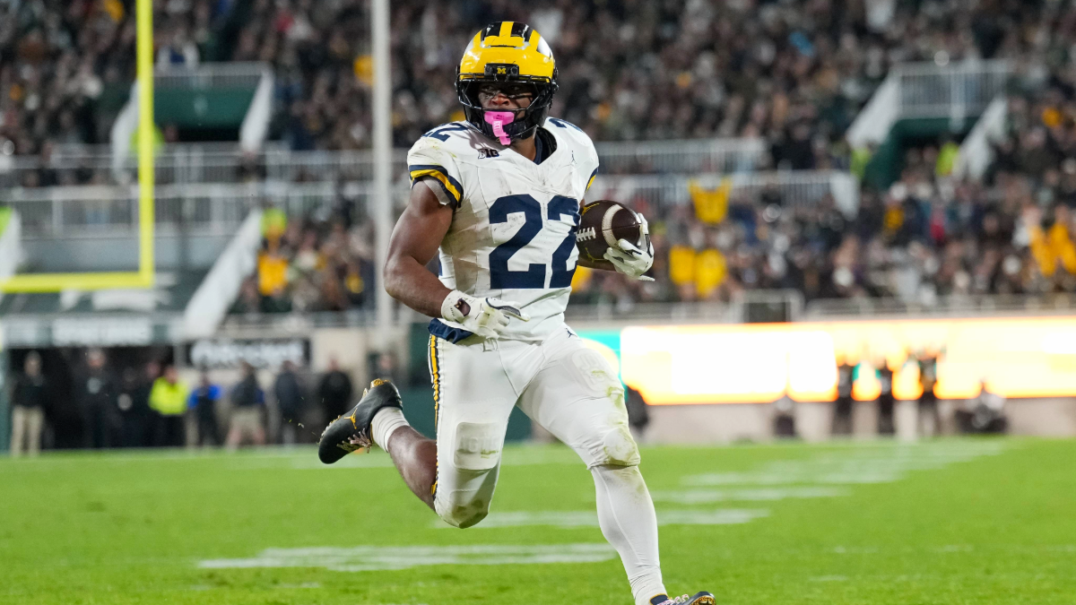 Justice Haynes #22 of the Michigan Wolverines runs in action to score a touchdown against the Michigan State Spartans during the third quarter at Spartan Stadium on October 25, 2025 in East Lansing, Michigan.