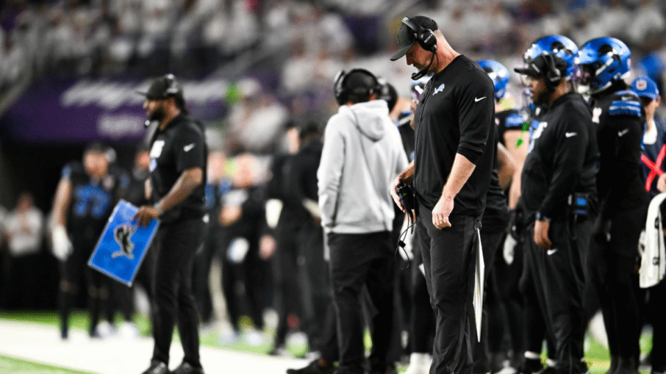 Dan Campbell head coach of the Detroit Lions looks on during the fourth quarter of the game against the Minnesota Vikings at U.S. Bank Stadium on December 25, 2025 in Minneapolis, Minnesota.