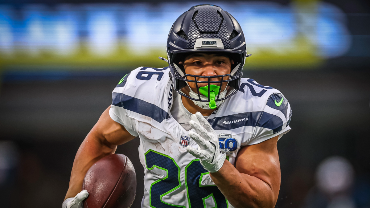 Zach Charbonnet #26 of the Seattle Seahawks runs the ball during the second half of the football game against the Carolina Panthers at Bank of America Stadium on December 28, 2025 in Charlotte, North Carolina.