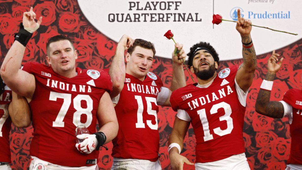 Pat Coogan #78, Fernando Mendoza #15, and Elijah Sarratt #13 of the Indiana Hoosiers celebrate after defeating the Alabama Crimson Tide 38-3 in the College Football Playoff Quarterfinal at Rose Bowl Stadium on January 01, 2026 in Pasadena, California. (Photo by Harry How/Getty Images)