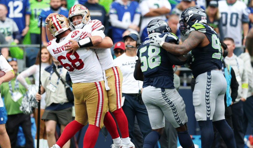 Brock Purdy #13 of the San Francisco 49ers celebrates a touchdown with Colton McKivitz #68 during the fourth quarter against the Seattle Seahawks during the game at Lumen Field on September 07, 2025 in Seattle, Washington.