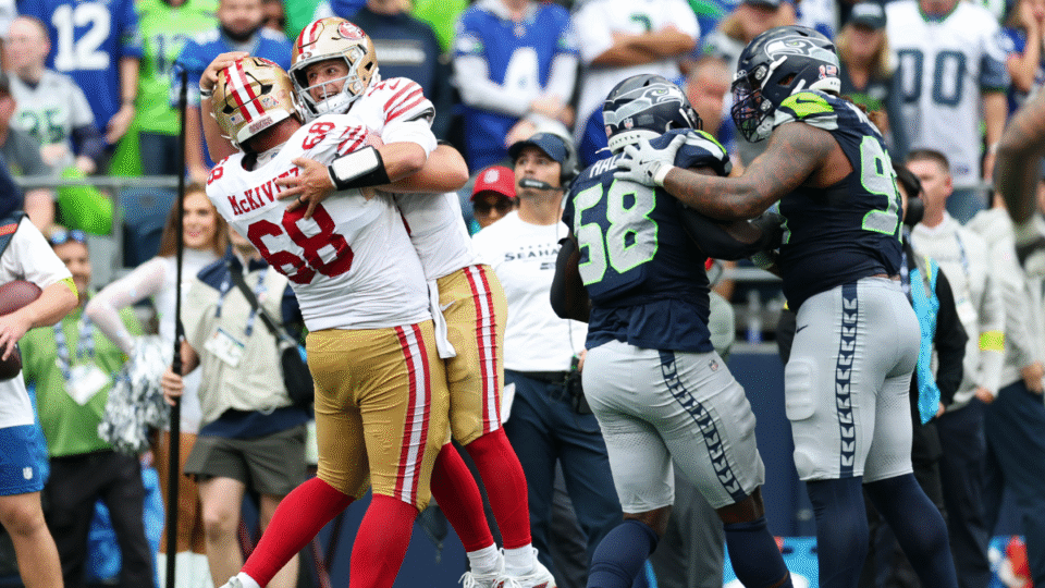 Brock Purdy #13 of the San Francisco 49ers celebrates a touchdown with Colton McKivitz #68 during the fourth quarter against the Seattle Seahawks during the game at Lumen Field on September 07, 2025 in Seattle, Washington.