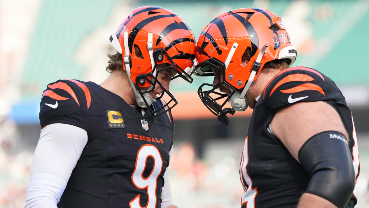 Joe Burrow #9 and Ted Karras #64 of the Cincinnati Bengals interact before the game against the Cleveland Browns at Paycor Stadium on January 04, 2026 in Cincinnati, Ohio.
