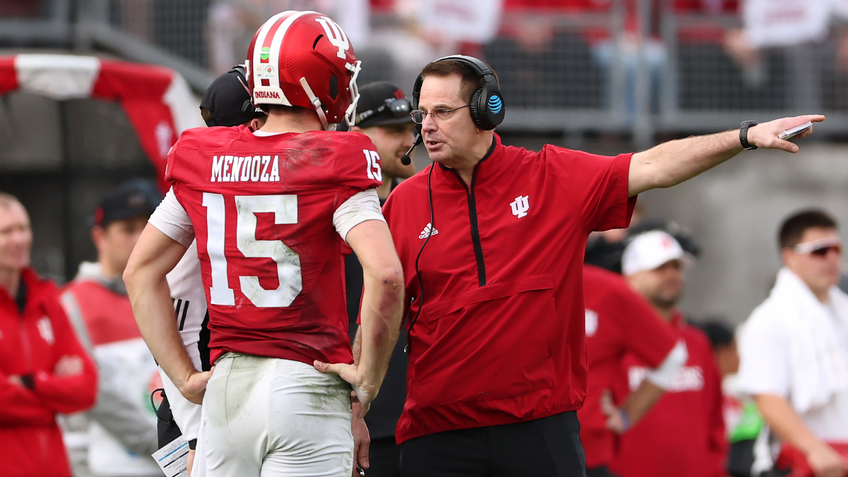 Head coach Curt Cignetti of the Indiana Hoosiers speaks to Fernando Mendoza #15 during the second quarter against the Alabama Crimson Tide in the College Football Playoff Quarterfinal at Rose Bowl Stadium on January 01, 2026 in Pasadena, California.