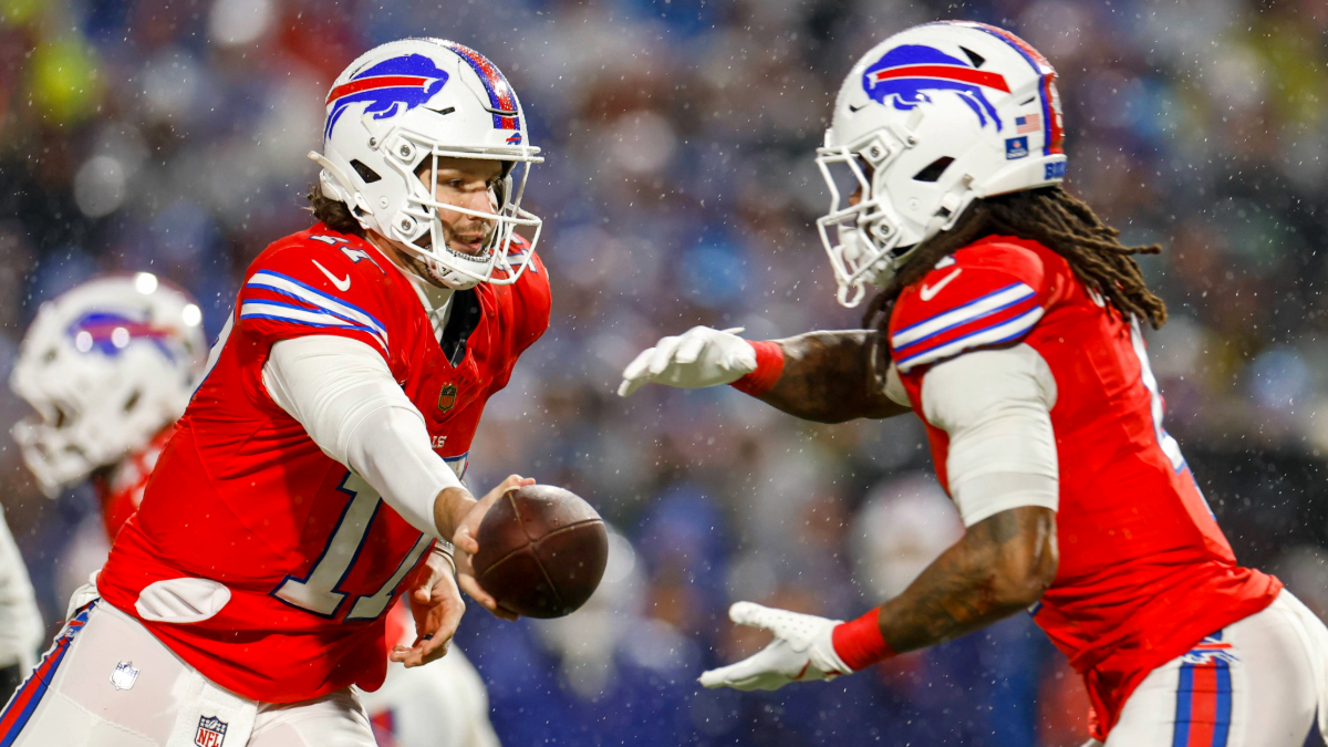 Josh Allen #17 of the Buffalo Bills hands the ball off to James Cook III #4 during the third quarter of the game against the Philadelphia Eagles at Highmark Stadium on December 28, 2025 in Orchard Park, New York.