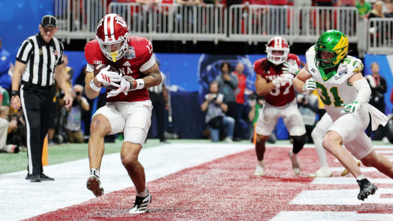Elijah Sarratt #13 of the Indiana Hoosiers catches a touchdown pass against the Oregon Ducks during the fourth quarter in the 2025 College Football Playoff Semifinal at the Chick-fil-A Peach Bowl at Mercedes-Benz Stadium on January 09, 2026 in Atlanta, Georgia.