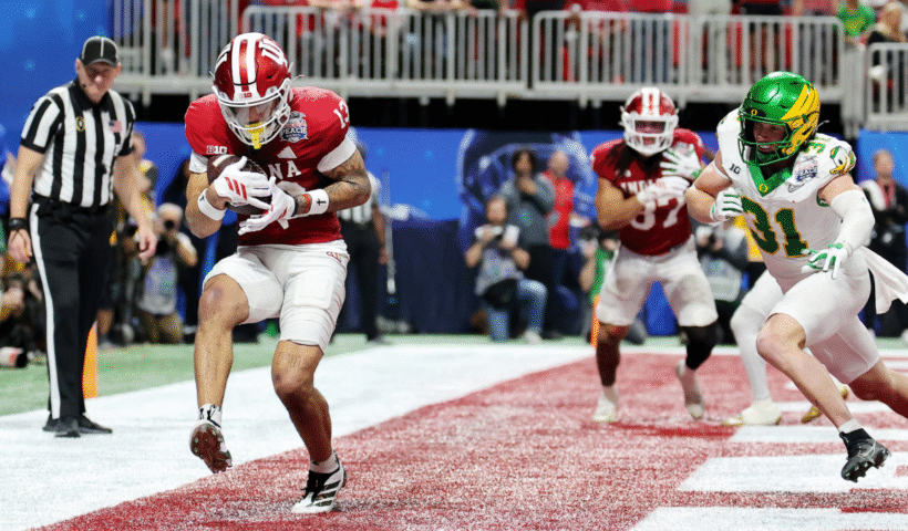 Elijah Sarratt #13 of the Indiana Hoosiers catches a touchdown pass against the Oregon Ducks during the fourth quarter in the 2025 College Football Playoff Semifinal at the Chick-fil-A Peach Bowl at Mercedes-Benz Stadium on January 09, 2026 in Atlanta, Georgia.
