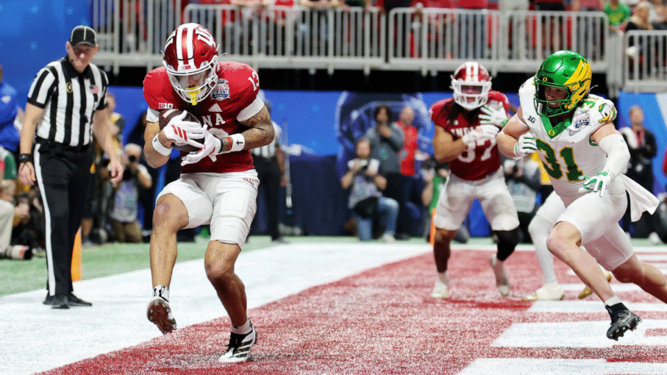 Elijah Sarratt #13 of the Indiana Hoosiers catches a touchdown pass against the Oregon Ducks during the fourth quarter in the 2025 College Football Playoff Semifinal at the Chick-fil-A Peach Bowl at Mercedes-Benz Stadium on January 09, 2026 in Atlanta, Georgia.