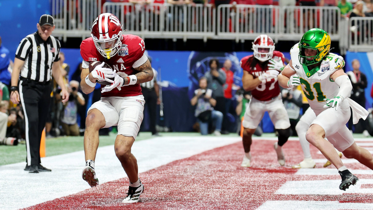 Elijah Sarratt #13 of the Indiana Hoosiers catches a touchdown pass against the Oregon Ducks during the fourth quarter in the 2025 College Football Playoff Semifinal at the Chick-fil-A Peach Bowl at Mercedes-Benz Stadium on January 09, 2026 in Atlanta, Georgia.