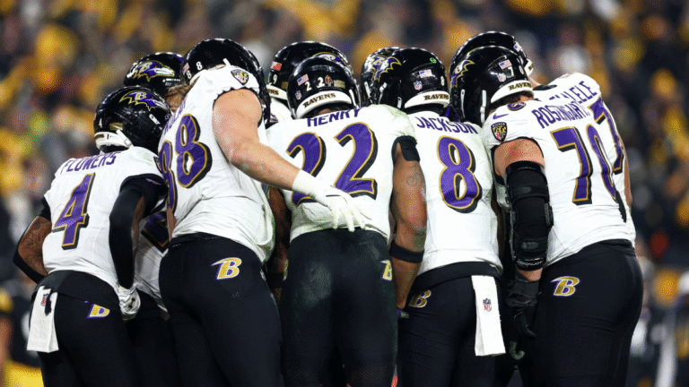 Baltimore Ravens players huddle during the fourth quarter against the Pittsburgh Steelers at Acrisure Stadium on January 4, 2026 in Pittsburgh, Pennsylvania.