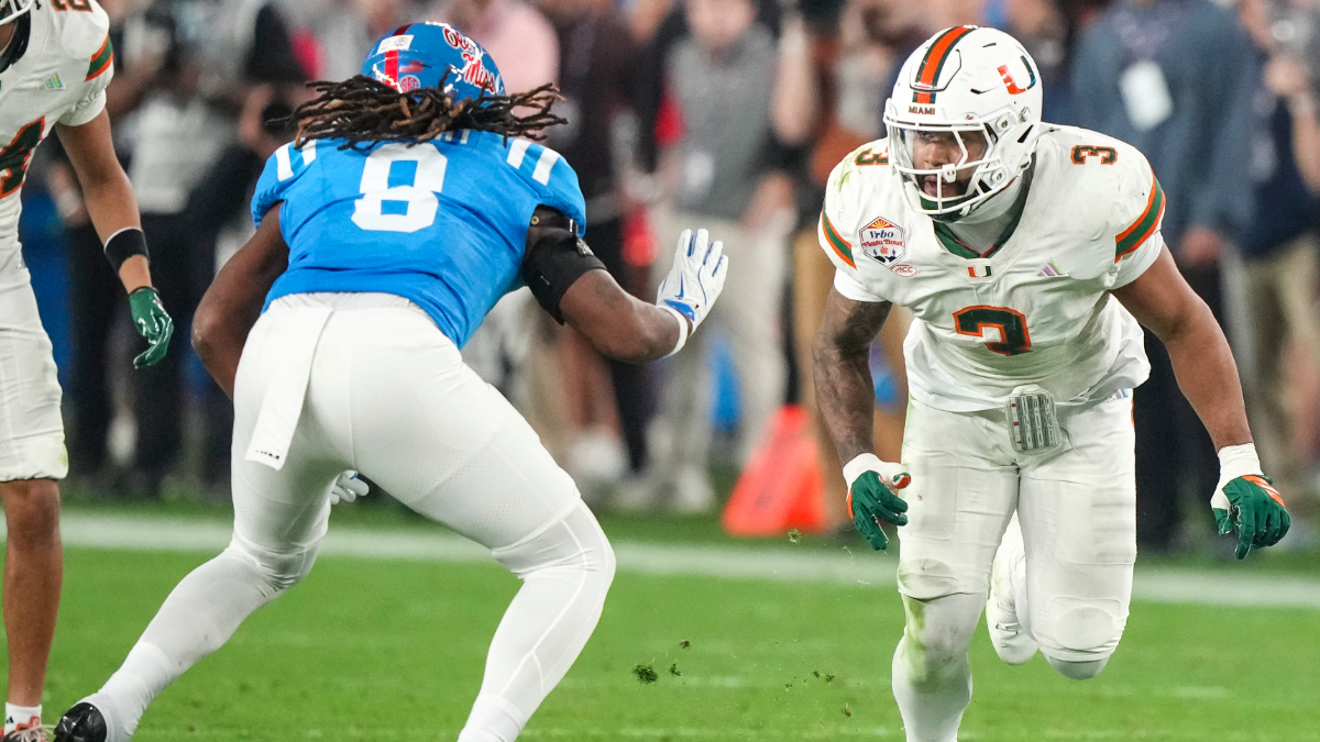Akheem Mesidor #3 of the Miami Hurricanes pressures by Dae'quan Wright #8 of the Ole Miss Rebels during the second half of CFP Semifinal Vrbo Fiesta Bowl at State Farm Stadium on January 8, 2026 in Glendale, Arizona.
