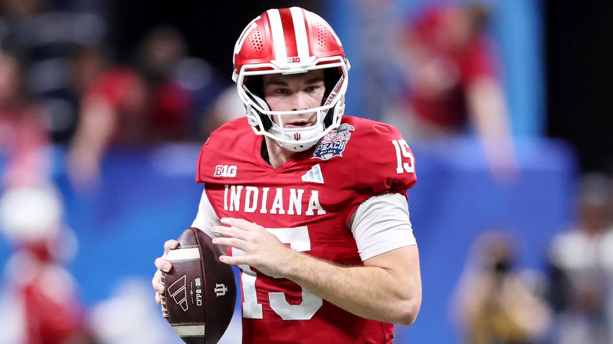 Fernando Mendoza #15 of the Indiana Hoosiers rolls out to pass against the Oregon Ducks during the second quarter in the 2025 College Football Playoff Semifinal at the Chick-fil-A Peach Bowl at Mercedes-Benz Stadium on January 09, 2026 in Atlanta, Georgia.