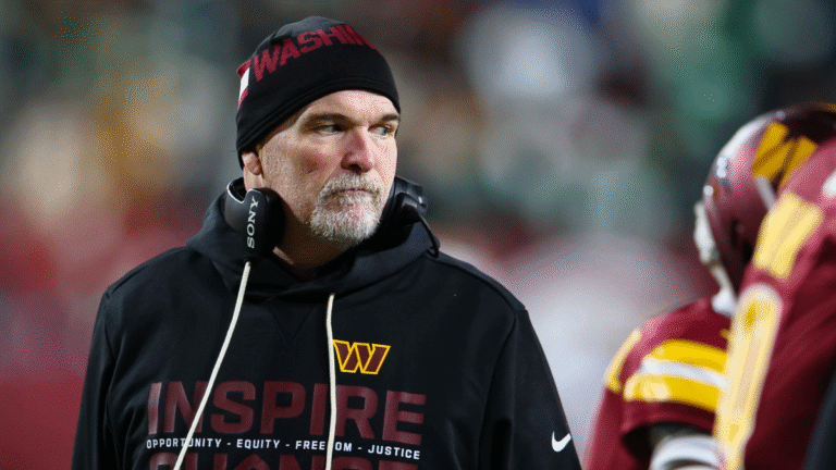 Head coach Dan Quinn of the Washington Commanders looks on against the Philadelphia Eagles during the first half of the NFL game at Northwest Stadium on December 20, 2025 in Landover, Maryland.