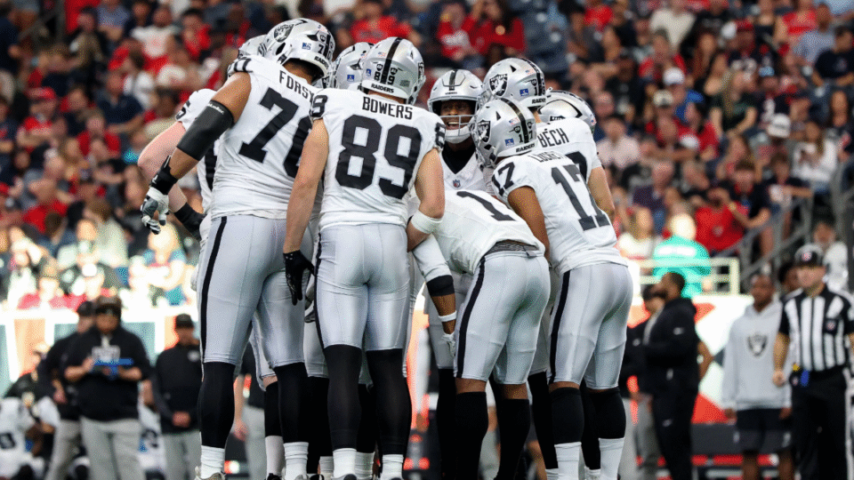 The Las Vegas Raiders huddle in the first half against the Houston Texans at NRG Stadium on December 21, 2025 in Houston, Texas.