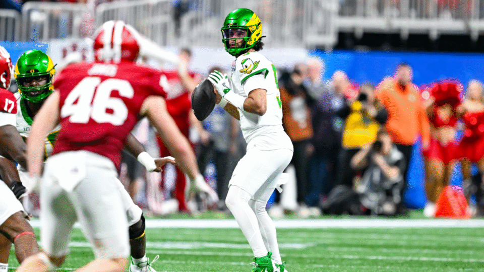 Oregon quarterback Dante Moore (5) drops back to pass during the Indiana Hoosiers versus Oregon Ducks College Football Playoff Semifinal at the Chick-fil-A Peach Bowl on January 9th, 2026, at Mercedes-Benz Stadium in Atlanta, GA.