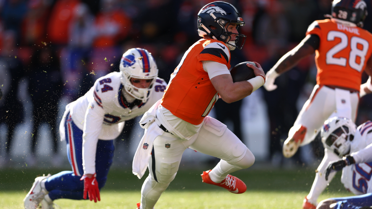 Bo Nix #10 of the Denver Broncos runs for a first down against the Buffalo Bills during the first quarter in the AFC Divisional Playoff game at Empower Field At Mile High on January 17, 2026 in Denver, Colorado.