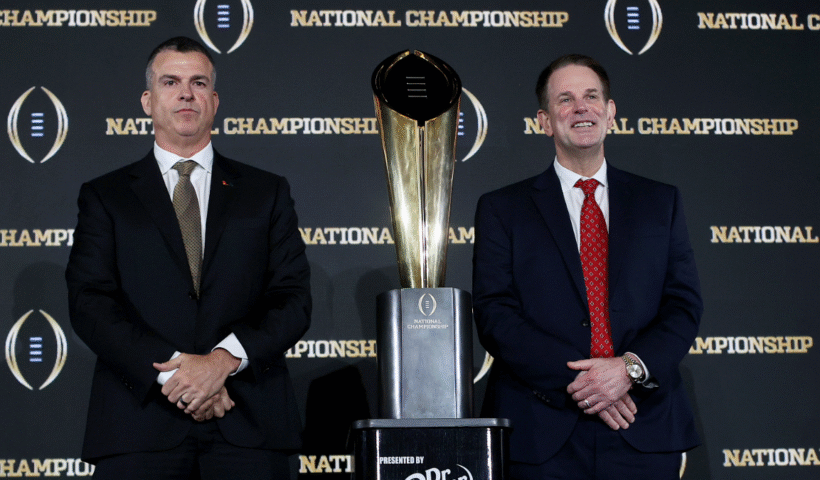 Head Coaches Mario Cristobal of the Miami Hurricanes and Curt Cignetti of the Indiana Hoosiers pose for a photo with the CFP National Championship trophy during the CFP National Championship Head Coaches News Conference at JW Marriott Marquis Miami on January 18, 2026 in Miami, Florida.