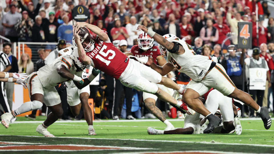 Fernando Mendoza #15 of the Indiana Hoosiers dives for a fourth quarter touchdown against the Miami Hurricanes in the 2026 College Football Playoff National Championship at Hard Rock Stadium on January 19, 2026 in Miami Gardens, Florida.