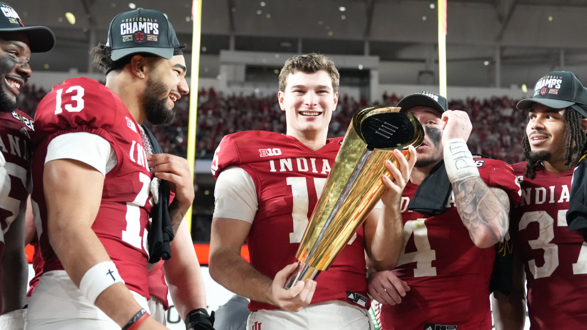 QB Fernando Mendoza #15 of the Indiana Hoosiers smiles as he holds the National Champsionship trophy following the Indiana Hoosiers versus the Miami Hurricanes College Football Playoff National Championship Game Presented by AT&T on January 19, 2026, at Hard Rock Stadium in Miami Gardens, FL.