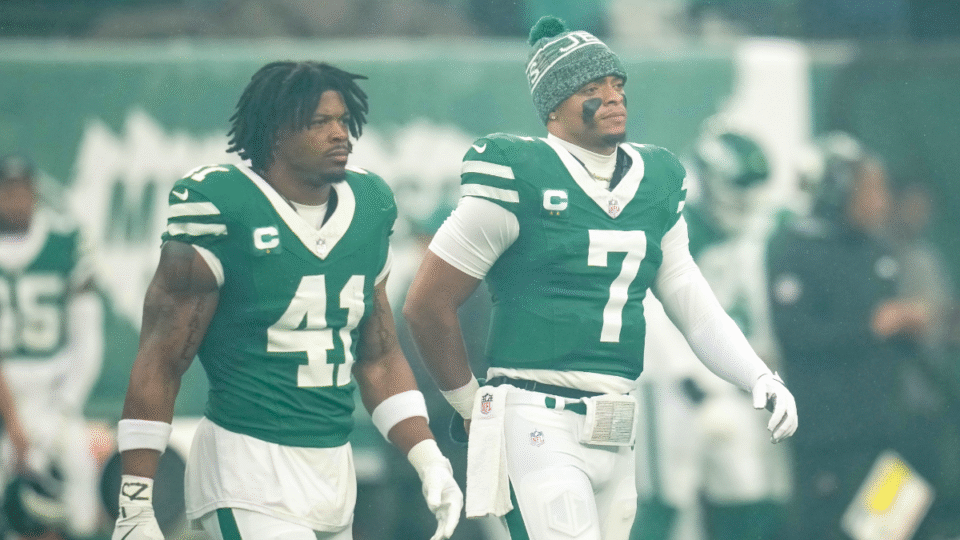 Marcelino McCrary-Ball #41 and Justin Fields #7 of the New York Jets look on before the game against the Atlanta Falcons at MetLife Stadium on November 30, 2025 in East Rutherford, New Jersey.