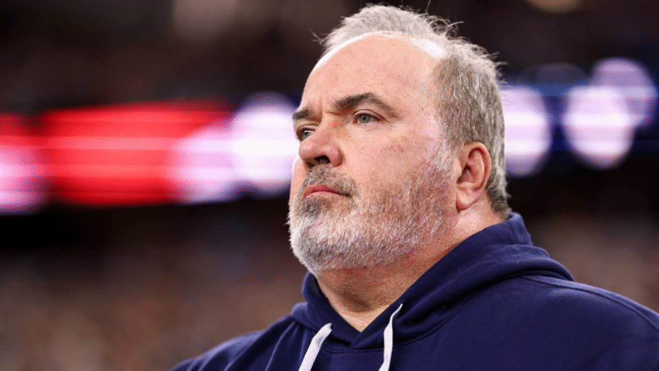 Head coach Mike McCarthy of the Dallas Cowboys stands on the sidelines during the national anthem prior to an NFL football game against the New York Giants at AT&T Stadium on November 28, 2024 in Arlington, Texas.