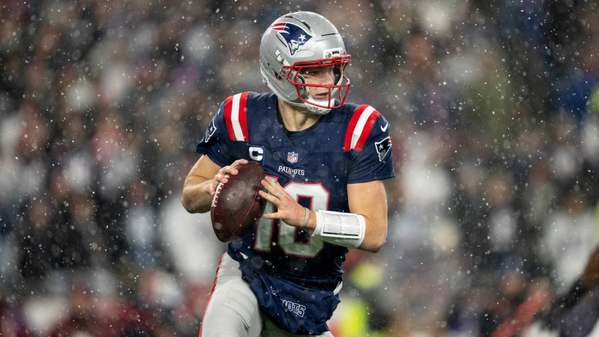 Drake Maye #10 of the New England Patriots scrambles and looks to pass during an NFC Divisional Playoff game against the Houston Texans at Gillette Stadium on January 18, 2026 in Foxborough, Massachusetts.
