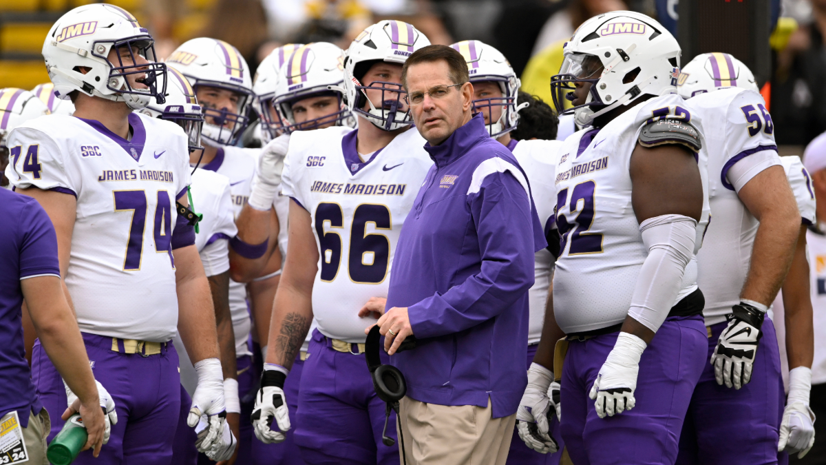 Head coach Curt Cignetti of the James Madison Dukes stands with his team during a first quarter timeout against the Appalachian State Mountaineers at Kidd Brewer Stadium on September 24, 2022 in Boone, North Carolina.