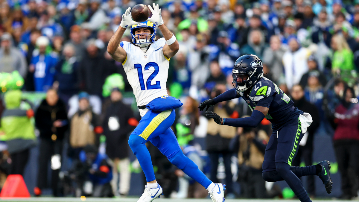 Puka Nacua #12 of the Los Angeles Rams makes a catch in front of Riq Woolen #27 of the Seattle Seahawks during the second quarter of the NFC Championship NFL football game, at Lumen Field on January 25, 2026 in Seattle, WA.