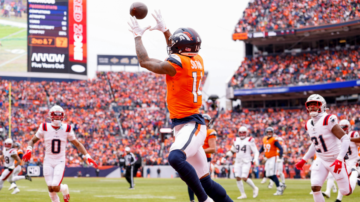 Courtland Sutton #14 of the Denver Broncos catches a touchdown during the first quarter of the AFC Championship game against the New England Patriots at Empower Field At Mile High on January 25, 2026 in Denver, Colorado.
