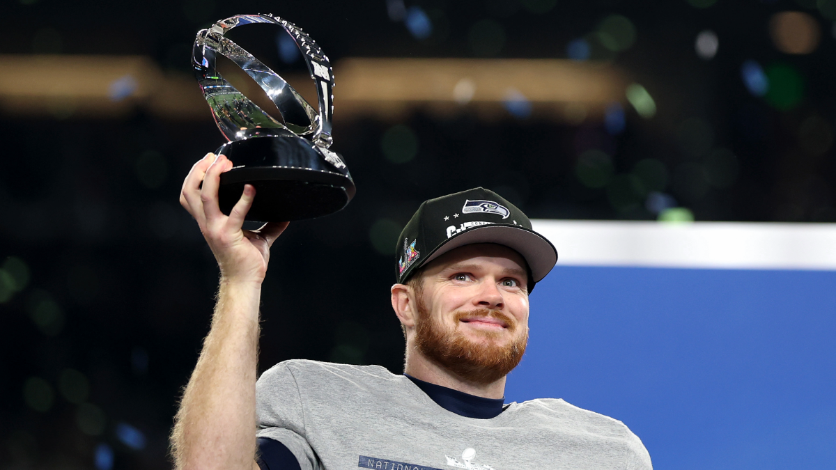 Sam Darnold #14 of the Seattle Seahawks celebrates with the George Halas Trophy after defeating the Los Angeles Rams 31-27 in the NFC Championship game at Lumen Field on January 25, 2026 in Seattle, Washington.