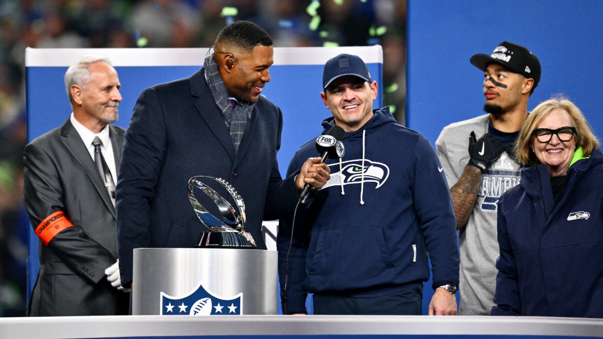 Former NFL player Michael Strahan interviews head coach Mike MacDonald and Jody Allen of the Seattle Seahawks during the George Halas Trophy presentation ceremony after Seattle defeated the Los Angeles Rams 31-27 in the NFC Championship game at Lumen Field on January 25, 2026 in Seattle, Washington. The Seahawks won 31-27.